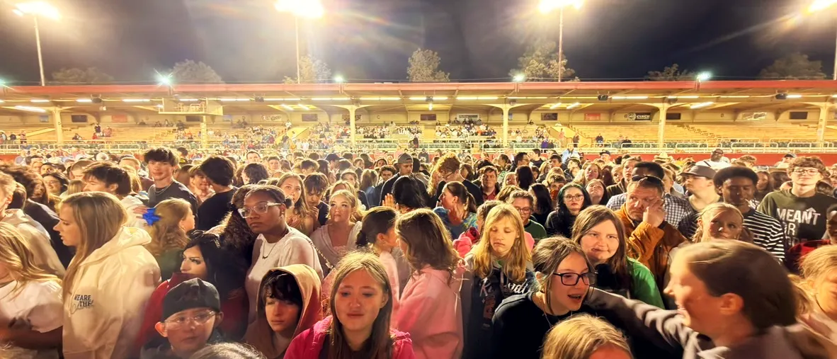 Students and leaders together under the arena lights